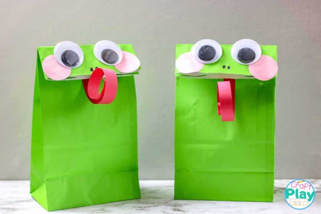 easy paper bag frog craft two frog paper bags together on a table
