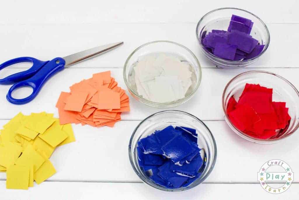 cutting up paper to make seed bombs